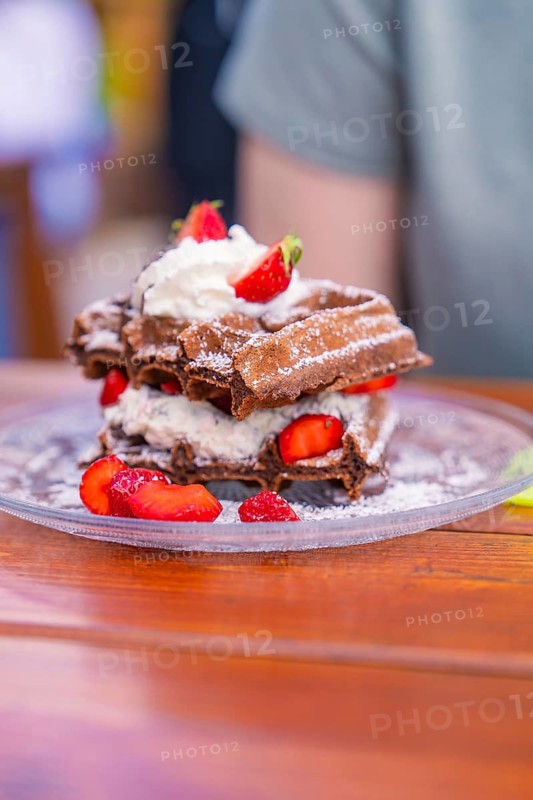 Delicious chocolate waffles served with cream and fresh strawberries, Cafehäusle Calw, Black Forest, Germany