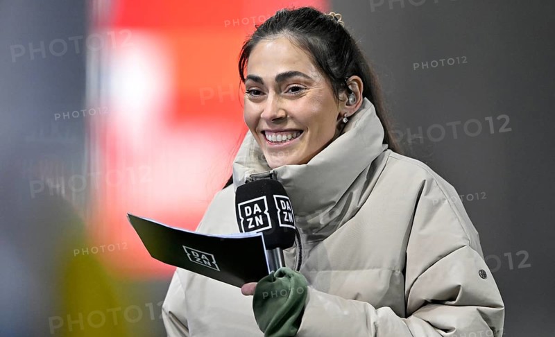 DAZN reporter presenter Ann-Sophie Kimmel, portrait, smiling, in interview microphone microphone logo, presentation cards, Voith-Arena, Heidenheim, Baden-Württemberg, Germany