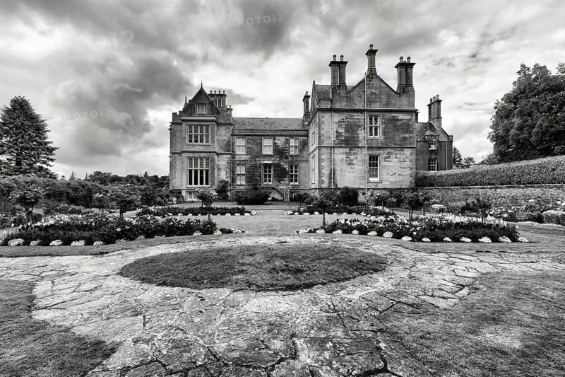 Manor house with gardens, Muckross House & Gardens, dramatic cloudy sky, monochromeKillarney National Park, Ring of Kerry scenic road, Iveragh Peninsula, County Kerry, Ireland