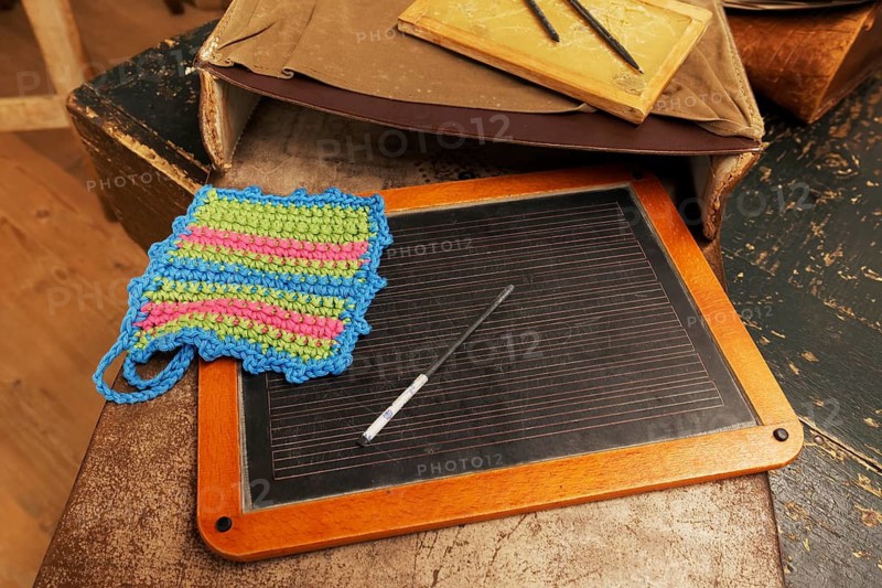 Slate board with crocheted cloth, school bag, Friedrichshafen School Museum, Baden-Württemberg, Germany