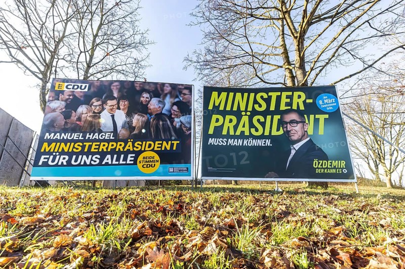 2026 state election in Baden-Württemberg. Election posters at a crossroads in Fellbach. Large posters of the top candidates from CDU and Die Grünen side by side. Fellbach, Baden-Württemberg, Germany