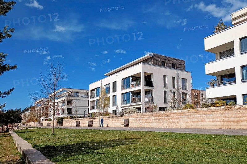 Heidelberg, Germany - March 19th 2026: Modern white cubic residential buildings in Heidelberg Bahnstadt district. Sustainable urban development and passive house architecture