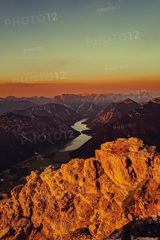 Thaneller summit at sunset in the Lechtal valley in Tyrol with a wonderful view of the surrounding mountains. Tyrol, Austria
