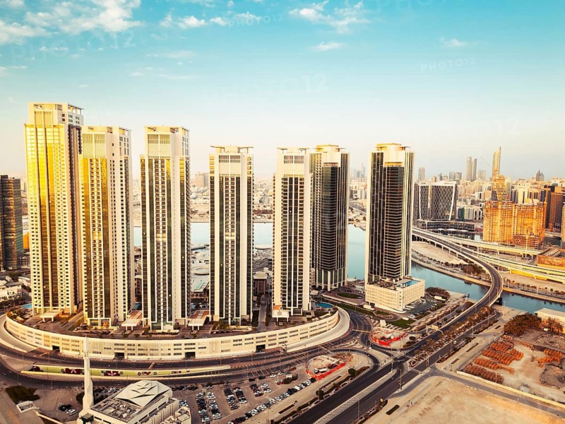 Abu Dhabi, UAE - 25th april, 2025: Abu Dhabi capital city UAE skyline with real estate buildings sunrise panorama with clear blue sky. Business real estate marina heights copy space banner