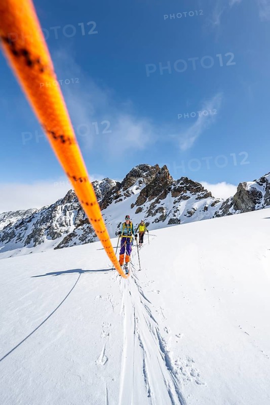 Ski tourer with rope, rope team on the Vadret da Porchabella glacier on the ascent to the summit of Piz Kesch, mountain landscape in winter, alpine tour, ski tour Bündner Haute Route, Albula Alps, Rhaetian Alps, Grisons, Eastern Switzerland, Switzerland