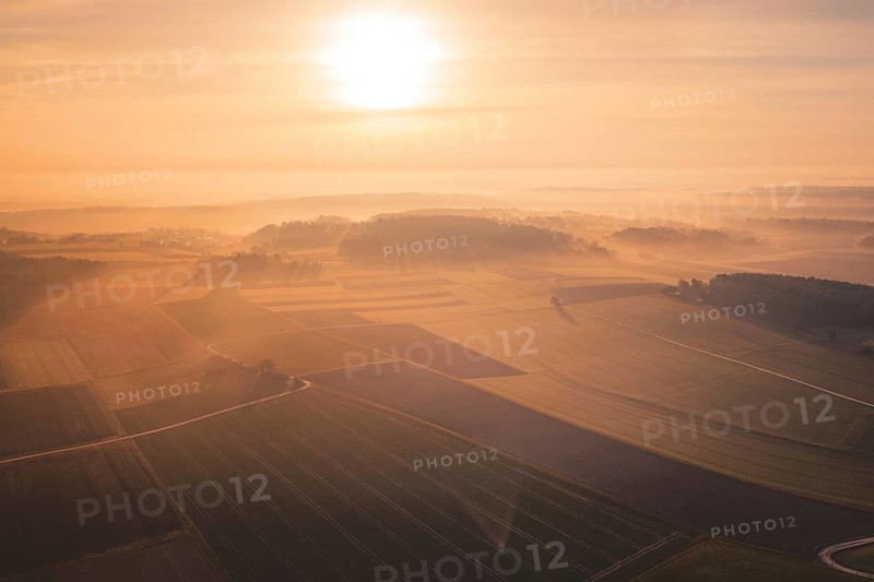 View of vast fields and forests in foggy sunrise, Gechingen, Calw district, Germany