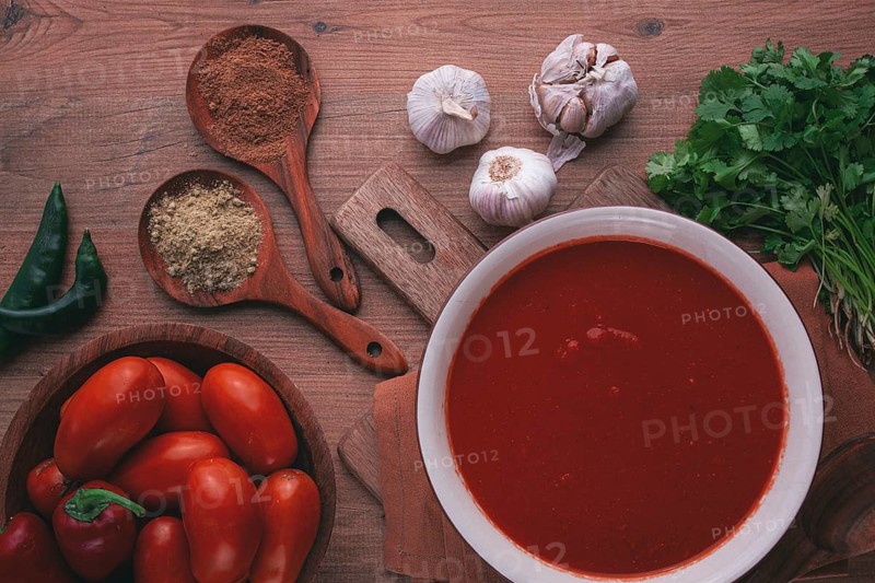 Georgian sauce, Satsebeli sauce, tomato and sweet pepper sauce, with spices, on a wooden table, homemade, no people