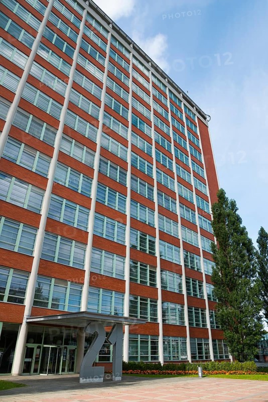 Modern office building with red brick façade and large windows under a blue sky, Batuv mrakodrap, Batas skyscraper, Zlín, Zlin, Zlínský kraj, Moravia, Czech Republic
