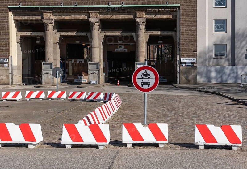 Red and white road barriers at the entrance to the Old Elbe Tunnel in Steinwerder, Hamburg, Germany
