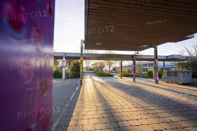 Sunny evening at a schoolyard with long shadows on the pavement, Schlehengäuschule, Gechingen, Hecken and Gäu region, Calw district, Germany