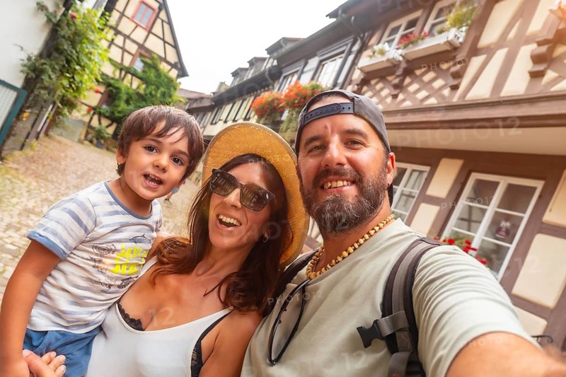 Selfie of a family in the medieval village in the old town of Gengenbach in the Black Forest, Germany, family vacation concept