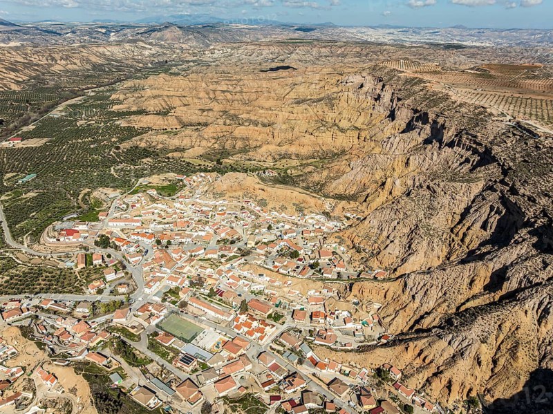 Village Gorafe at the foot of a deep gorge, aerial view, Gorafe Desert, UNESCO Granada Geopark, Granada province, Andalusia, Spain