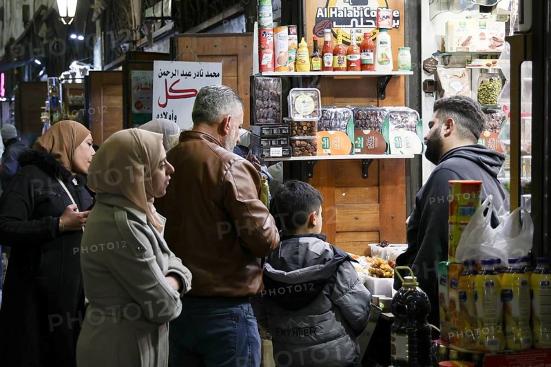 Syrians shop at the historic Al-Hamidiyah Bazaar adjacent to the Umayyad Mosque during the early days of Ramadan in Damascus, Syria on February 18, 2026, Damascus, Syria
