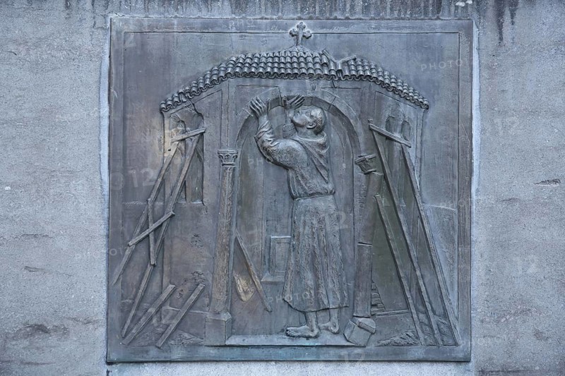 Relief of Saint Francis with symbol of the historic structure of the church, church institution, modern art, Hadamar, Westerwald, Hesse, Germany
