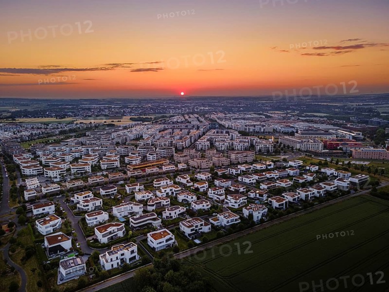 The sun rises behind the Riedberg district of Frankfurt. (Aerial photo with a drone), Riedberg, Frankfurt am Main, Hesse, Germany