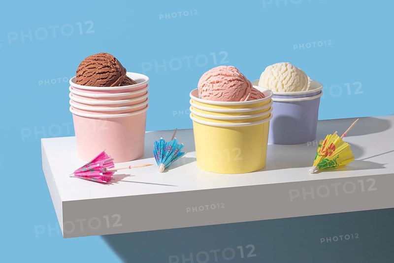 A minimalist presentation of chocolate, strawberry, and vanilla ice cream. The bright colors and clean background create a modern, eye catching image