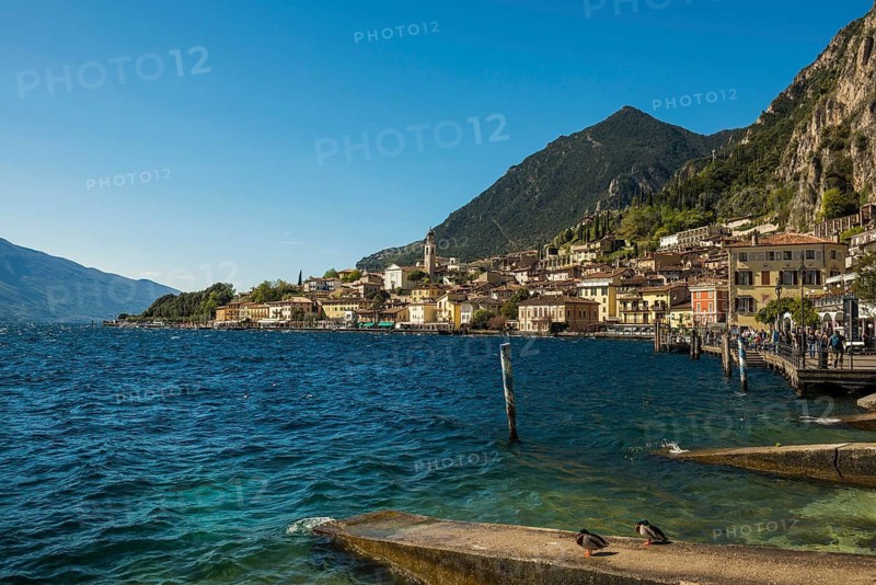 Picturesque village and colorful houses on the lake and steep mountains, Limone sul Garda, Lake Garda, Brescia province, Lombardy region, Italy