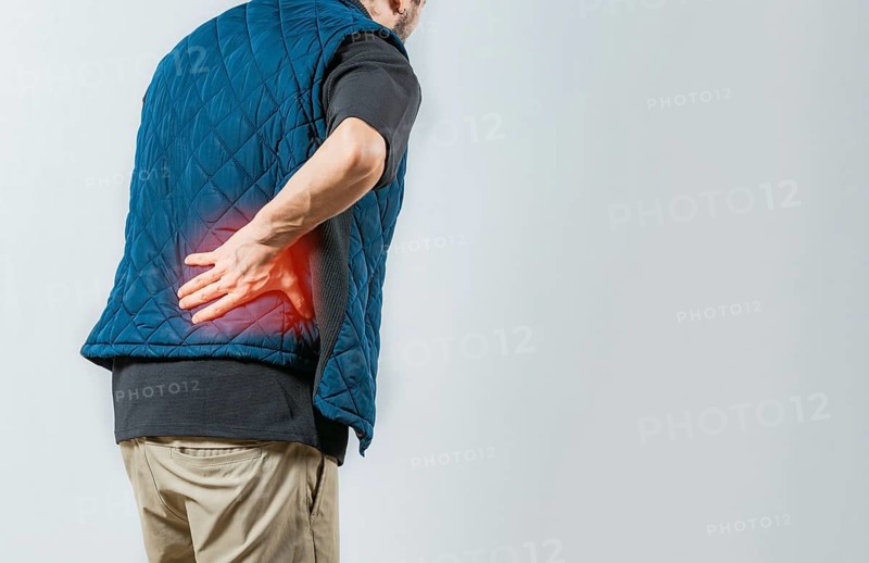Person with pain holding his lower back isolated. Male person with spine problems, Lumbar problems concept