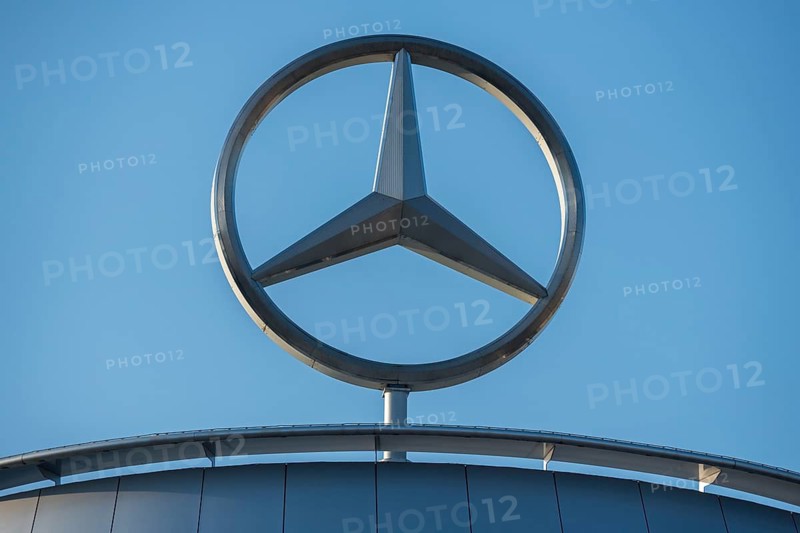 Close-up of the Mercedes star on a metallic building in front of a clear sky, Stuttgart-Untertürkheim, Baden-Württemberg, Germany