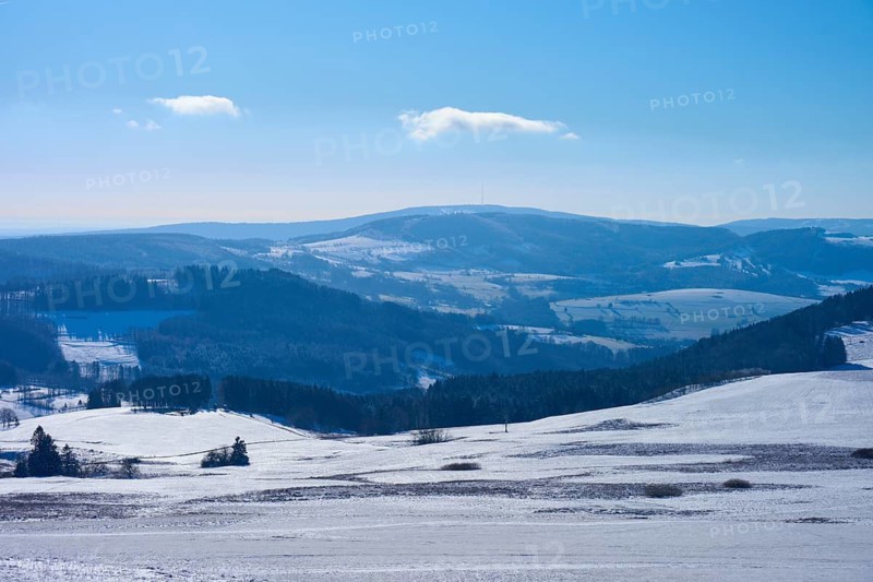 Snow-covered hills with blue sky and clouds, winter, Kreuzberg, Wasserkuppe, Gersfeld, Rhön, Hesse, Germany