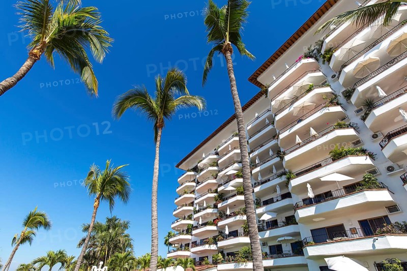 Luxury condominiums and apartments on Playa De Los Muertos beach and pier close to the famous Puerto Vallarta Malecon, the city largest public beach