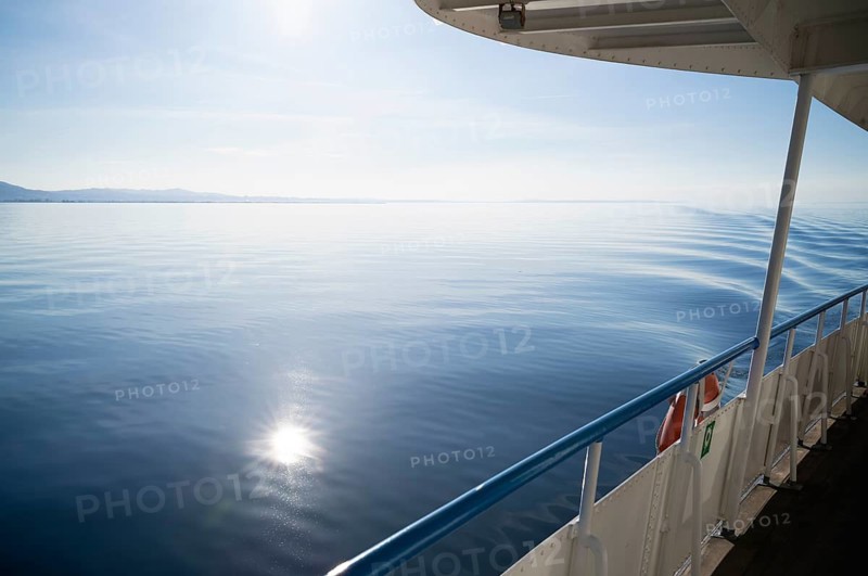 View from a ferry, boat, of water, waves, Bregenz, Vorarlberg, Lake Constance, Austria