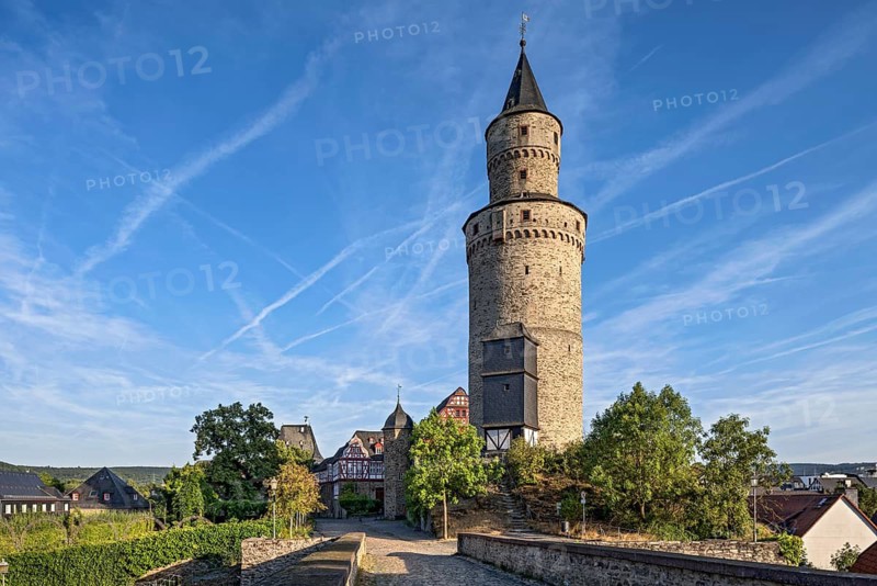 Witches' tower, keep of Idstein Castle, butter barrel tower, bridge over the Halsgraben in front, historic old town, contrails of aeroplanes, Idstein, Rheingau Taunus district, German Half-timbered Road, Hesse, Germany