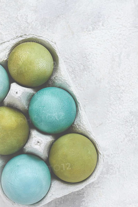 Easter colored eggs, in green and turquoise tones, Easter card, top view, no people