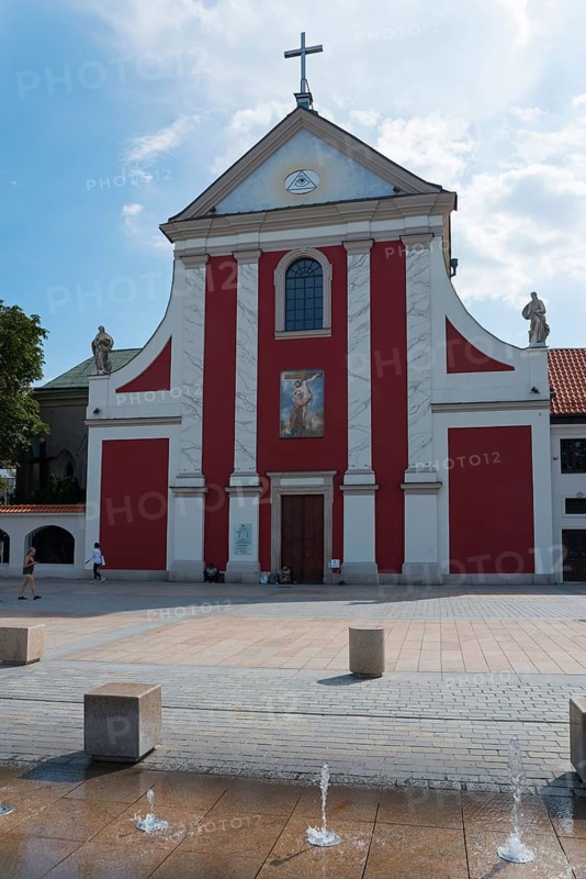 Church with striking red façade and adjoining fountain, Church of St Peter and Paul, Litewski Square, Lithuanian Square, Lublin, Poland