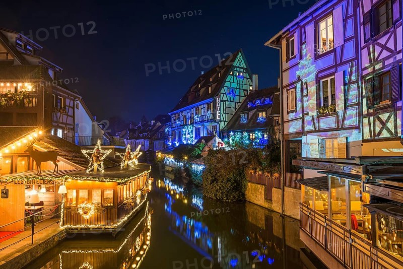 Colourfully illuminated and Christmassy decorated half-timbered houses, old town, blue hour, Colmar, Haut-Rhin department, Alsace, France