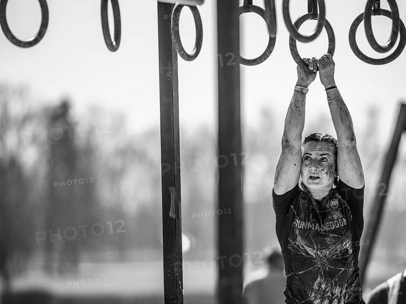 WROCLAW, POLAND - APRIL 7, 2018: Extreme running with obstacle RUNMAGEDDON. In the picture a runner on the Recruit route