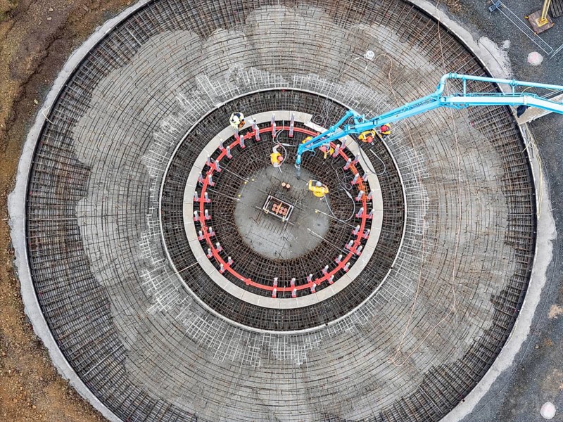 Concreting, concreting the foundation of a wind turbine, more than 600 cubic meters of concrete will be pumped into the foundation for over 7 hours, over 100 tons of reinforcing steel have been used, the wind turbine will have a hub height of 160 meters, part of a new wind farm in Sauerland, near Balve, North Rhine-Westphalia, Germany