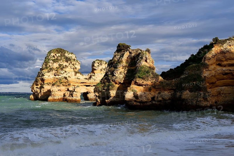 Rock formations on the coast in the evening light, Praia do Camilo, Lagos, Algarve, Portugal