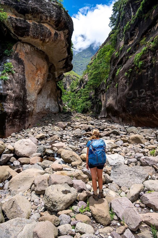 Female hiker in the Tugela Gorge or Tugela Gorge in the riverbed, Drakensberg National Park, KwaZulu Natal, South Africa