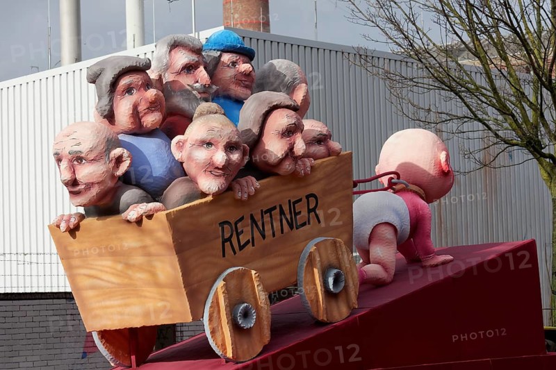Crawling baby pulls carts full of pensioners, pension discussion, theme car by Jacques Tilly, Düsseldorf Rose Monday train, Düsseldorf, North Rhine-Westphalia, Germany