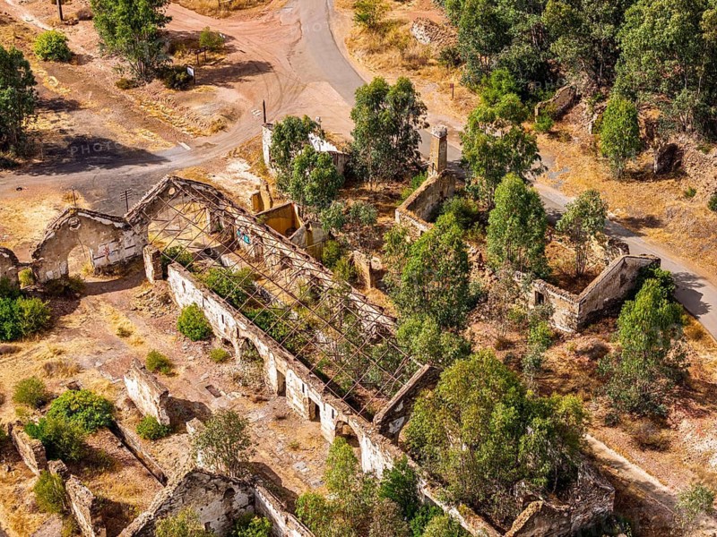 Ruins of former workshop halls, Mina de Sao Domingos, historic copper open-pit mine, aerial view, Portugal