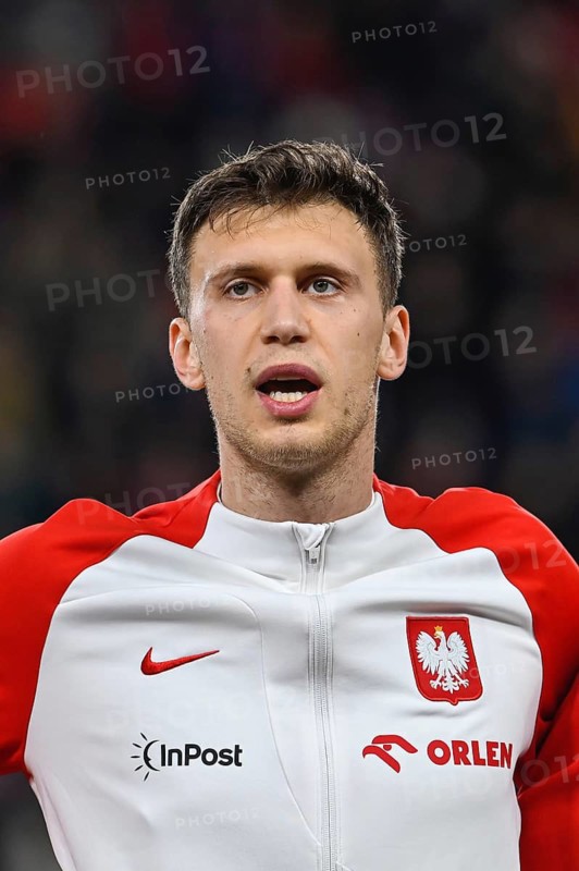 PRAGUE, CZECH REPUBLIC - MARCH 24, 2023: Qualifications for UEFA Euro 2024. Match Czech Republic - Poland 3:1. Krystian Bielik during anthem.