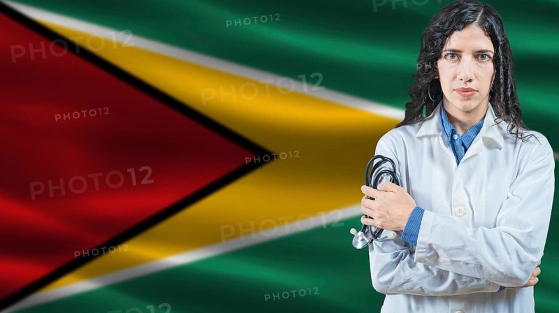 Guyanese national health system, Medical professional on Guyana flag background