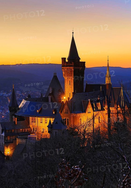 Atmospheric view of the illuminated Wernigerode Castle at sunset, Harz Mountains, Saxony-Anhalt, Germany