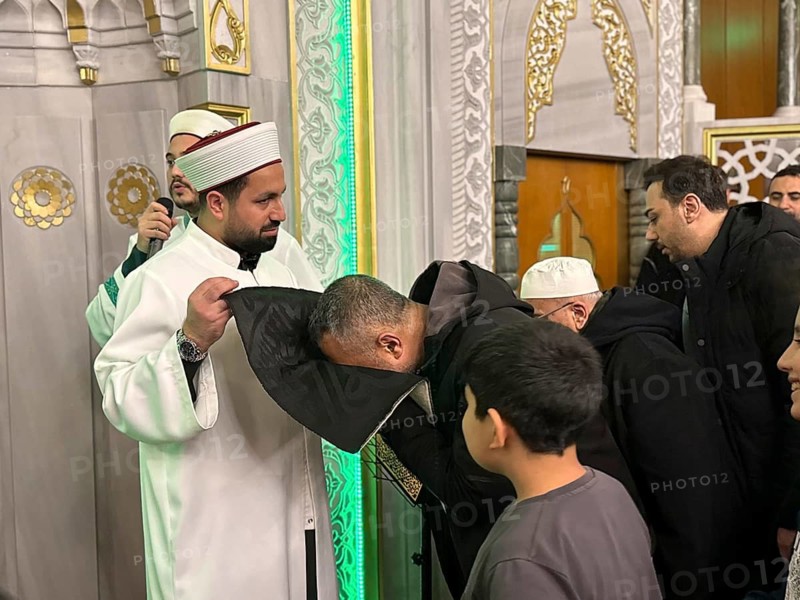 Dozens of Muslims stand in a long queue to view a sacred piece of the Kaaba curtain (Kiswa) while observing Laylat al-Qadr with prayers and supplications during the holy month of Ramadan in Gaziantep, Turkey on March 16, 2026, Gaziantep, Turkey