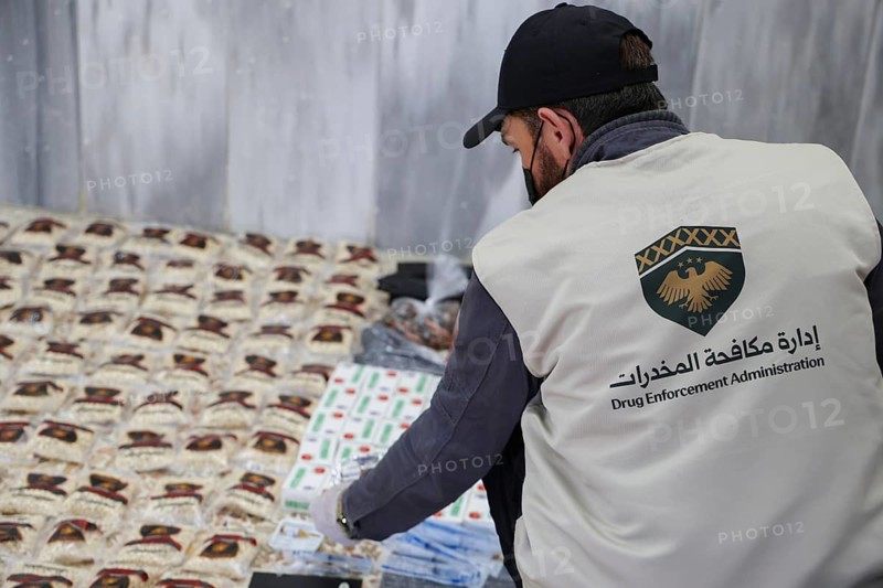 Personnel from the Syrian Anti-Narcotics Directorate display a massive cache of confiscated illegal drugs following a successful operation against an organized crime network in the Jaramana district. The major bust resulted in the seizure of 670 kilograms of cannabis, 172, 000 Captagon pills, 1.3 kilograms of crystal meth, and 340 grams of cocaine, showcased at the directorate's headquarters in Damascus, Syria on April 15, 2026, Damascus, Syria