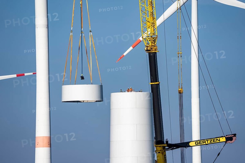 Construction site of the new Bedburg 3 wind farm, on recultivated open-cast mining site, 9 wind power plants with an output of 60 megawatts are being built, installation of the wind turbine tower operated by RWE and the city of Bedburg, North Rhine-Westphalia, Germany