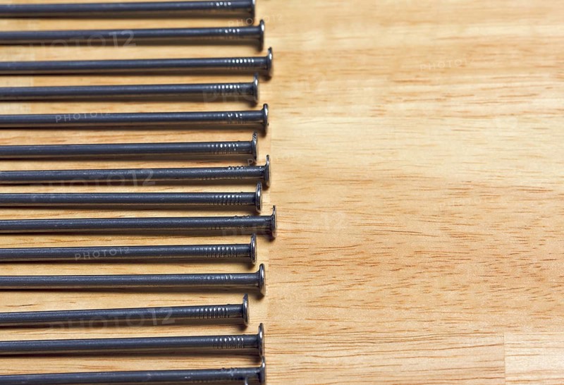 Macro of Nails on a Wood Background