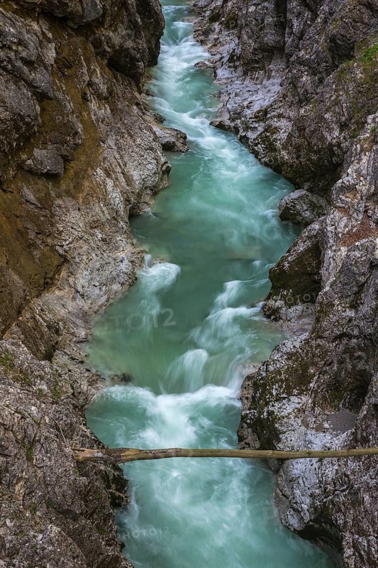 The Lammer creek is flowing fast through the Lammerklamm on a sunny hiking day