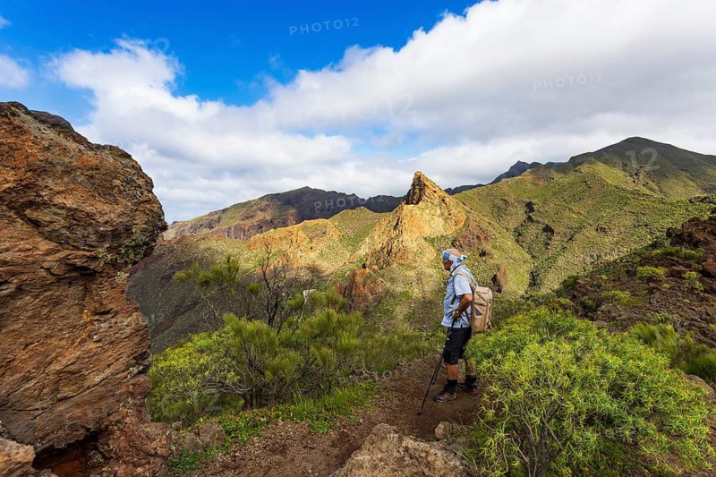 Mountain hike over Santiago Valley, Montana de Guama, hiker with view to Risco Blanco, Tenerife, Canary Islands, Spain