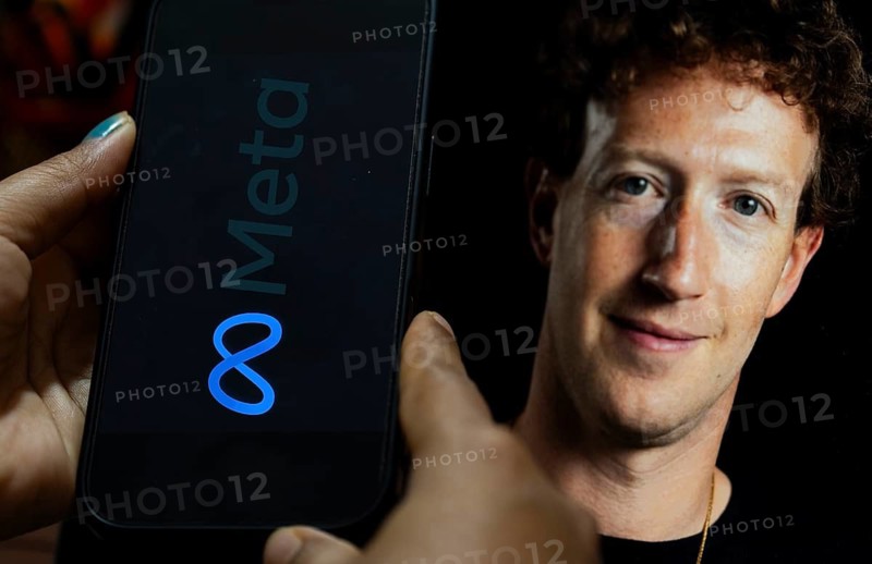 In this photo illustration, a smartphone displays the Meta logo on its screen with an image of Meta CEO Mark Zuckerberg visible in the background. in New Delhi, India on 13 March 2026