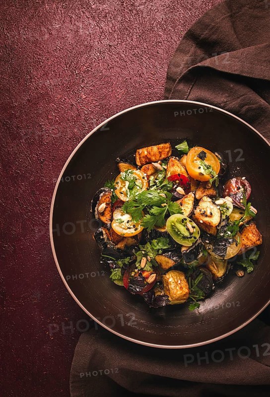 Warm Salad, Saksuka, with crispy eggplant, and tomatoes, spices, herbs, sesame seeds, sunflower seeds, Turkish cuisine, no people