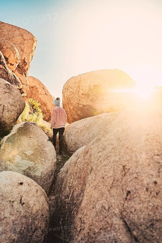 Woman hiking at sunrise in Joshua Tree National Park