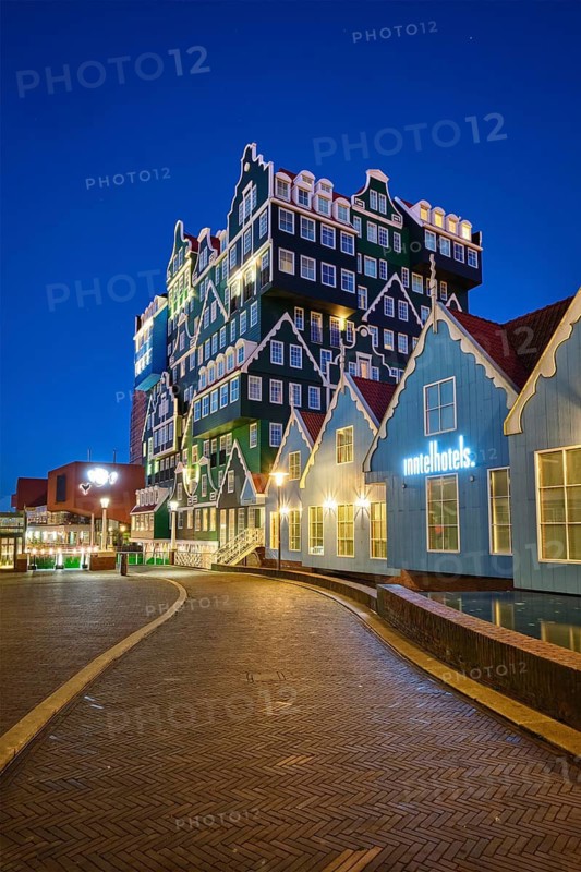 ZAANDAM, NETHERLANDS, MAY 8, 2017: Inntel Hotel in Zaandam illuminated at night. Design of 12-storey tall building opened in 2009 is the result of stacking a series of traditional Dutch houses