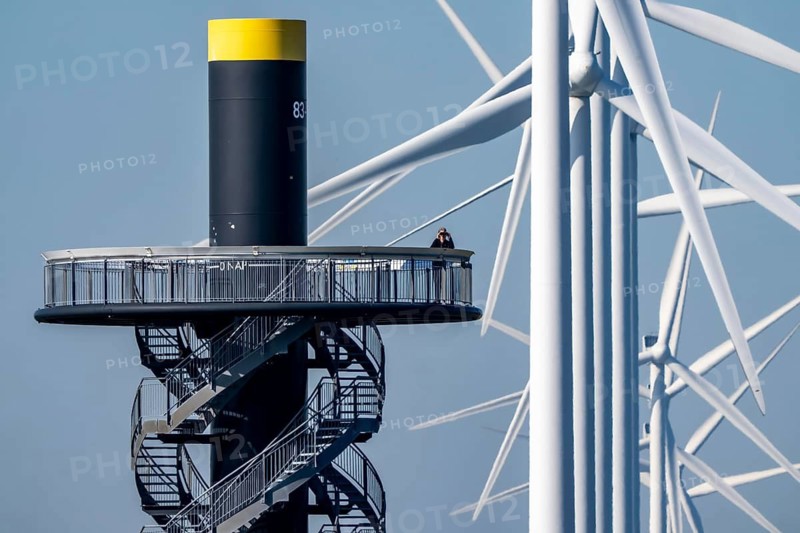 Viewing platform at Landtong Rozenburg wind farm, Noordzeeweg, Paal 83 watchtower 22 meters high, behind it 11 Vestas wind turbines, with an output of 34 MW and an annual result of 117 gigawatts, which corresponds to the consumption of approximately 43, 000 households, on a promontory on Nieuwe Waterweg, at Europoort harbour, hub height 130 meters, rotor diameter 26 meters, near Rotterdam, the Netherlands